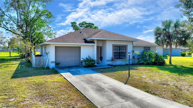 single story home featuring a garage and a front lawn