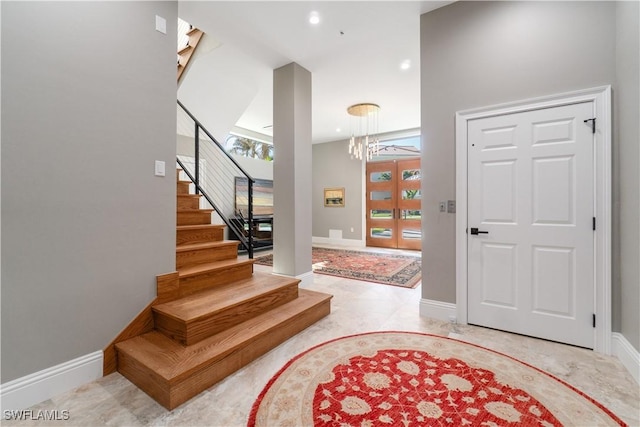 entrance foyer with a chandelier