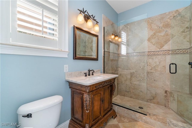 bathroom with a shower with door and vanity