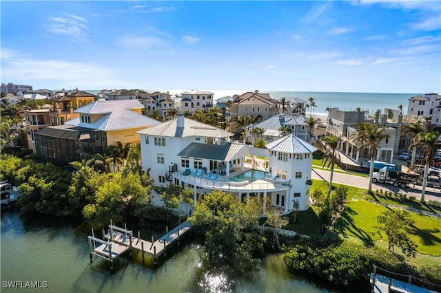 birds eye view of property featuring a water view