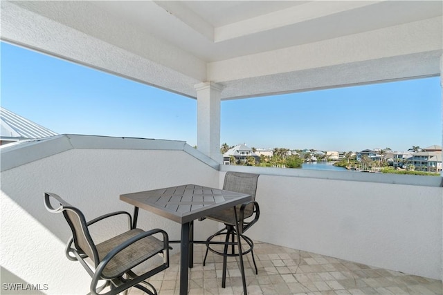 balcony featuring a water view