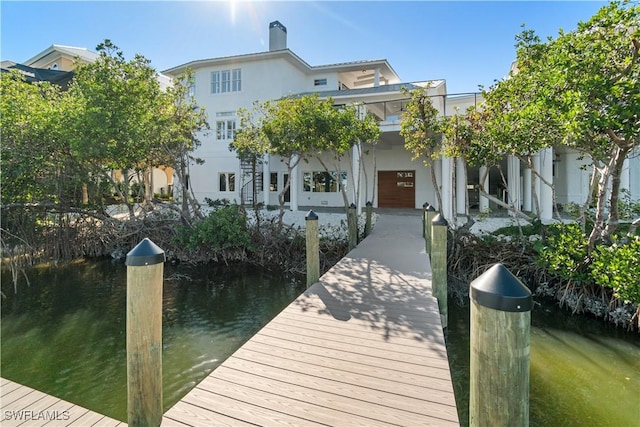 dock area with a water view