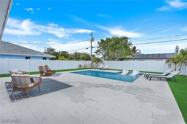 view of pool featuring a patio area