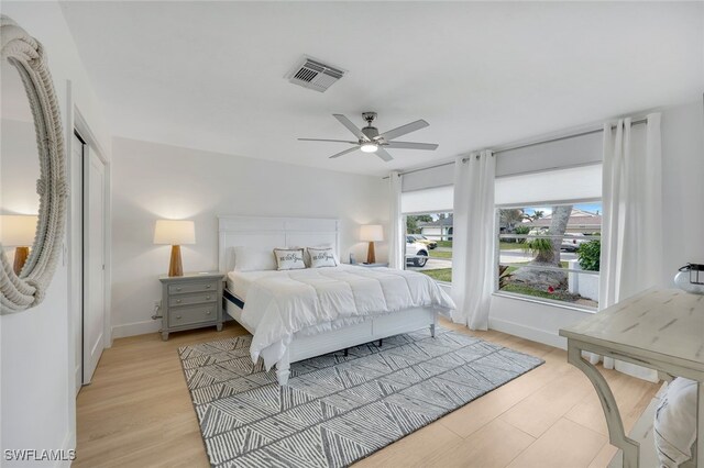 bedroom featuring ceiling fan and light hardwood / wood-style flooring