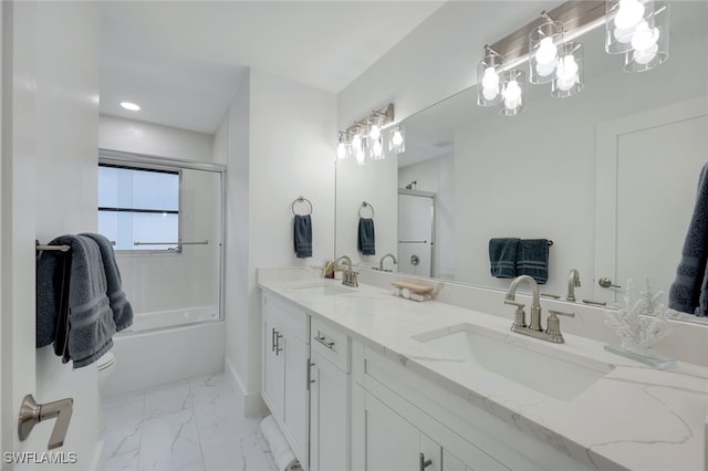639 98th Ave N, Naples, FL 34108 - bathroom with marble look tile flooring, double vanity, enclosed tub / shower combo, and recessed lighting