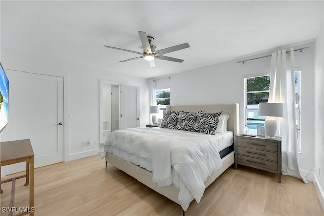 bedroom with ceiling fan and light hardwood / wood-style flooring