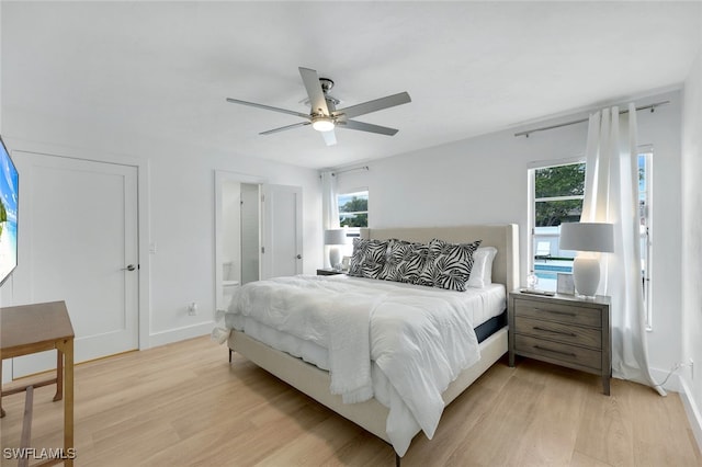 639 98th Ave N, Naples, FL 34108 - bedroom featuring light wood-style floors, ceiling fan, and baseboards