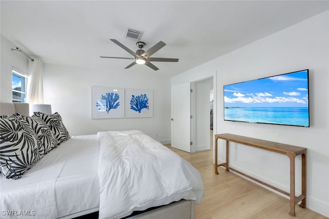 bedroom with ceiling fan and light hardwood / wood-style floors