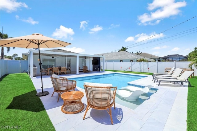 639 98th Ave N, Naples, FL 34108 - view of swimming pool featuring a ceiling fan, an outdoor living space, and a patio