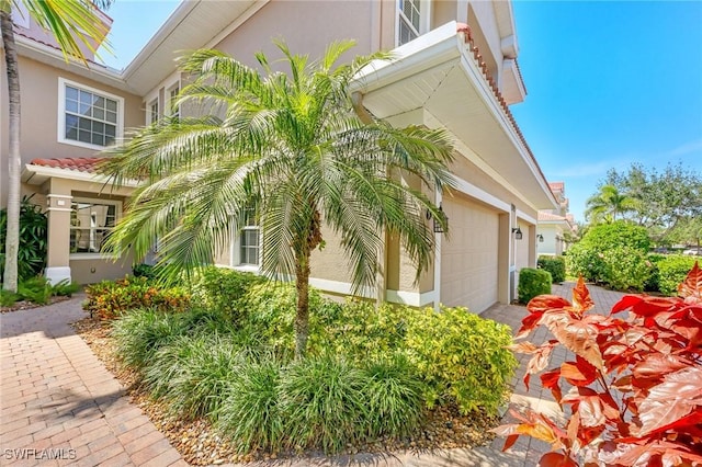 view of property exterior featuring a garage