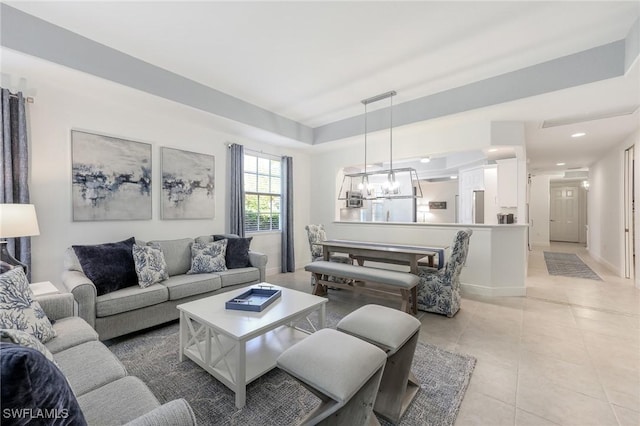 living room featuring light tile patterned floors, a chandelier, and recessed lighting