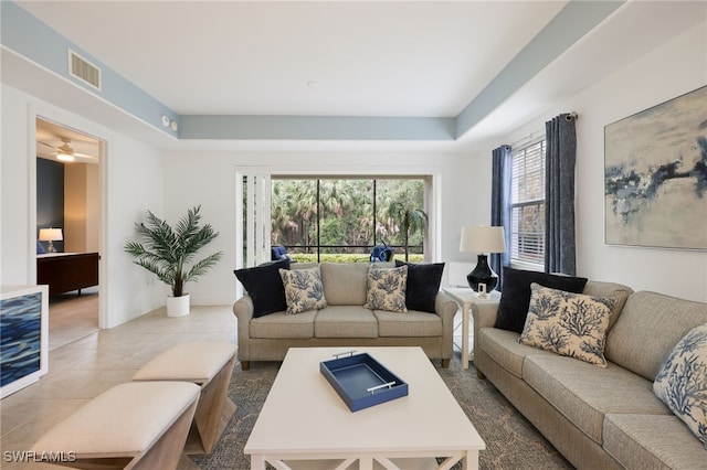 tiled living area featuring visible vents