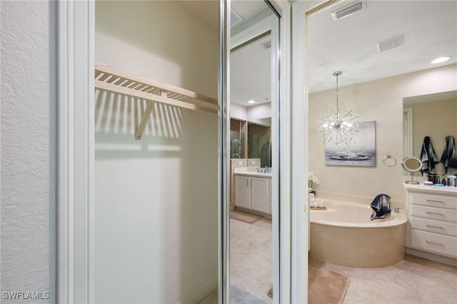 bathroom featuring visible vents, tile patterned flooring, and vanity