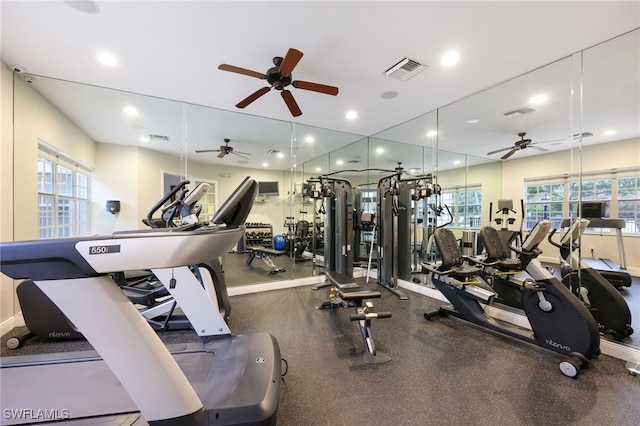 workout area with baseboards, visible vents, and recessed lighting