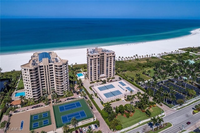 drone / aerial view featuring a view of the beach and a water view