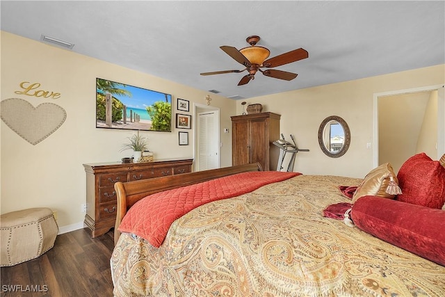 bedroom with ceiling fan and dark hardwood / wood-style flooring