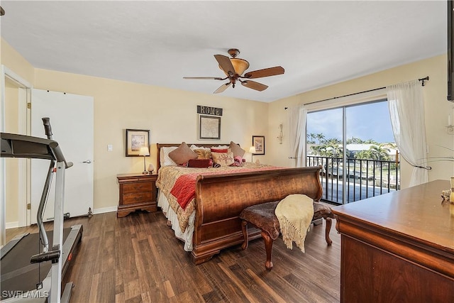 bedroom featuring access to outside, ceiling fan, dark hardwood / wood-style flooring, and a water view