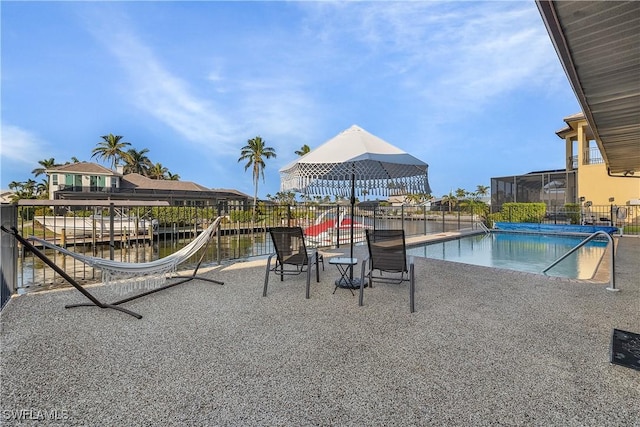 view of swimming pool with a water view