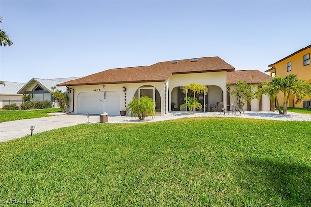 view of front of property featuring a garage and a front yard