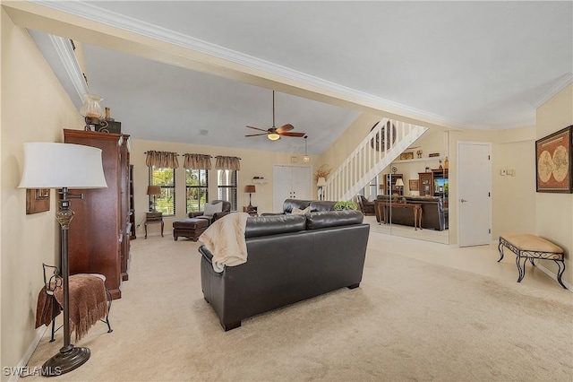 living room featuring light carpet, ceiling fan, and ornamental molding