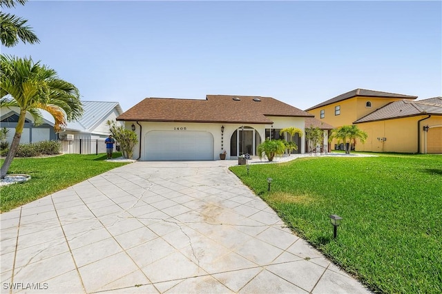 view of front of property with a garage and a front yard