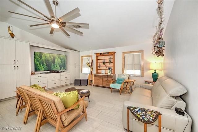 living room with lofted ceiling and ceiling fan