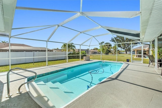 view of swimming pool featuring a gazebo, a patio area, glass enclosure, and a yard