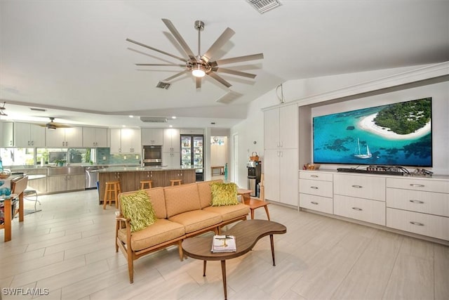 living room featuring lofted ceiling