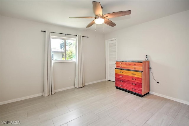 unfurnished room featuring ceiling fan