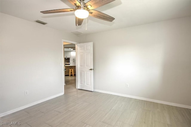 spare room featuring ceiling fan