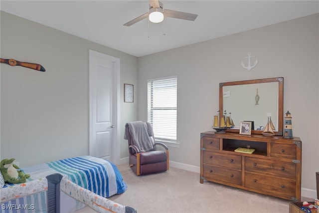 living area with ceiling fan and light colored carpet