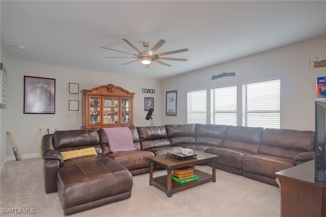 living room featuring ceiling fan and light colored carpet