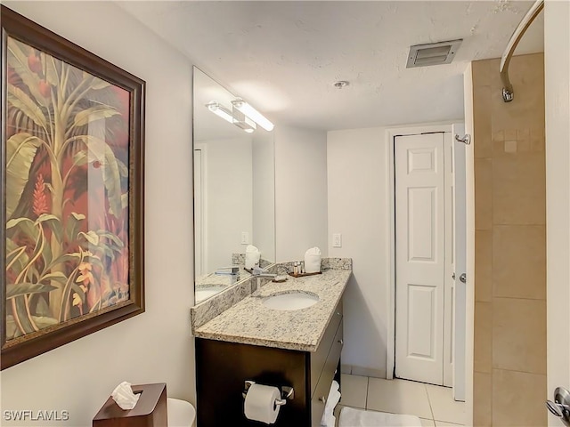 bathroom with vanity and tile patterned floors