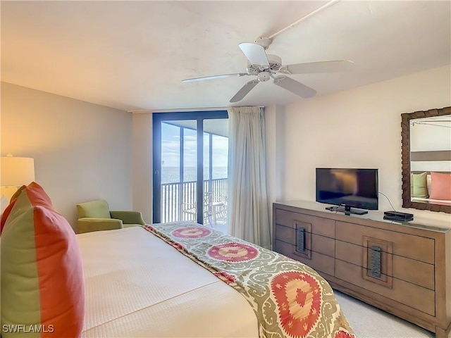 carpeted bedroom featuring access to outside and ceiling fan