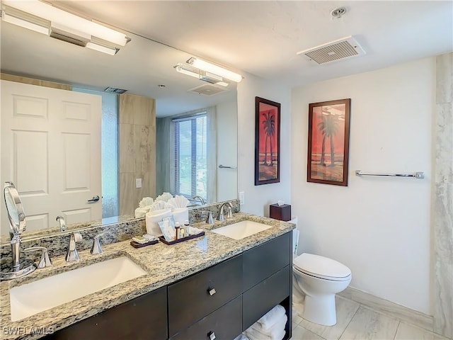 bathroom with vanity and toilet