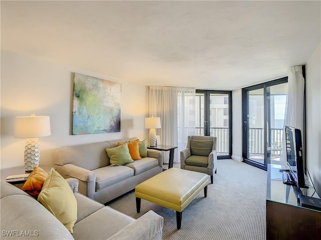 living room with light carpet, a wall of windows, and french doors