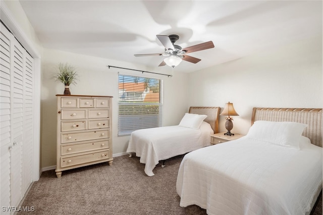 carpeted bedroom with a closet and ceiling fan