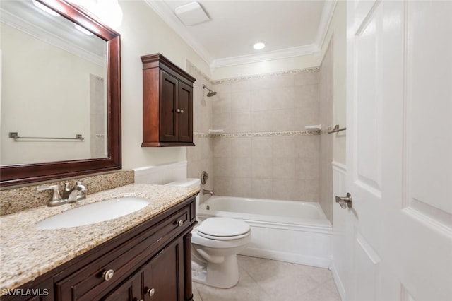 full bathroom featuring tiled shower / bath combo, tile patterned floors, vanity, toilet, and crown molding