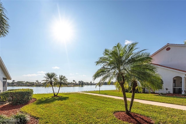 exterior space with a water view