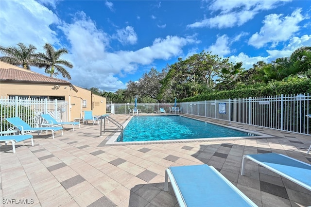 view of swimming pool featuring a patio