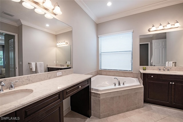 bathroom with crown molding, tile patterned floors, tiled bath, and vanity