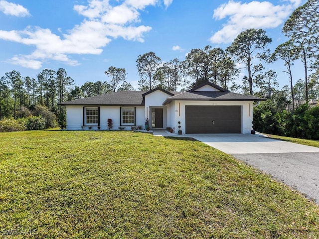 single story home with a garage and a front lawn