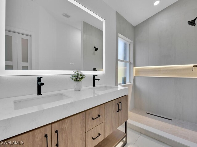 bathroom with walk in shower and vanity