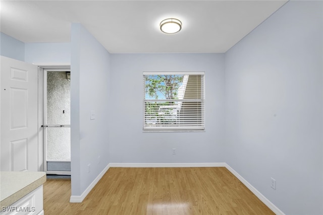 empty room featuring wood-type flooring