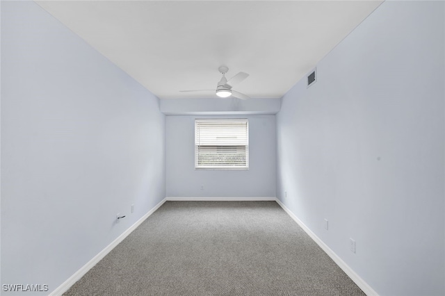 empty room featuring ceiling fan and carpet flooring