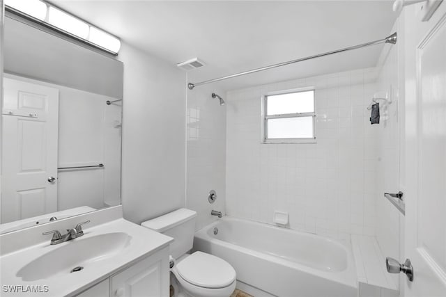 full bathroom featuring vanity, toilet, and tiled shower / bath