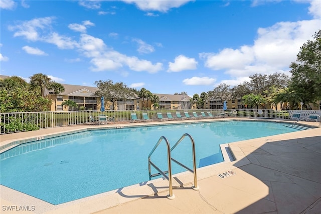 view of swimming pool with a patio area