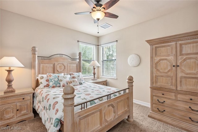 bedroom featuring ceiling fan and light carpet