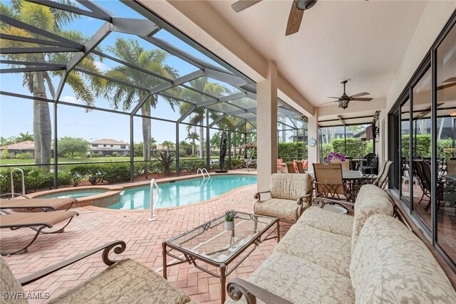 view of swimming pool featuring a lanai, an in ground hot tub, outdoor lounge area, and a patio