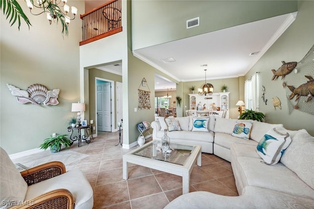 tiled living room with a notable chandelier and crown molding